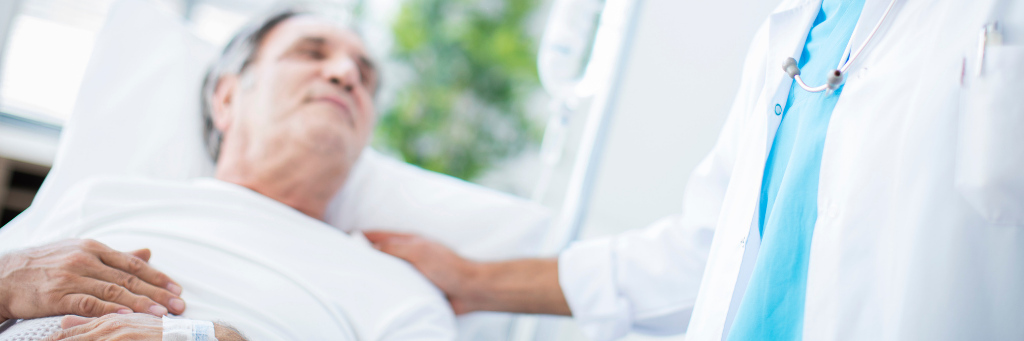 Elderly man in hospital bed