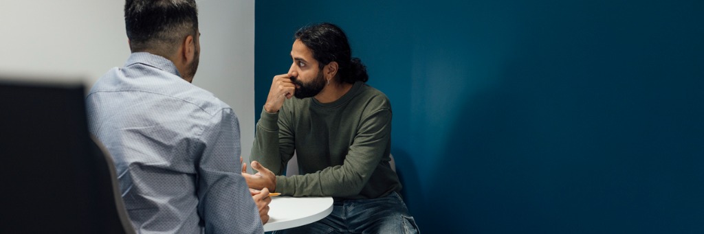 Two men having a conversation.