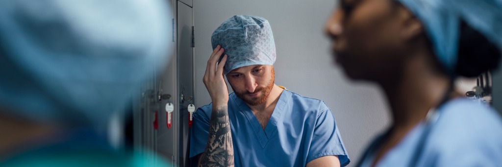 Worried surgeon in hospital scrubs.