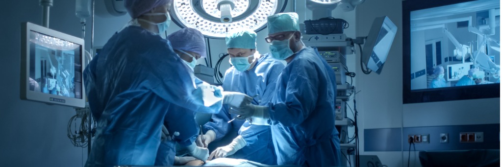 Surgical team operating in theatre.