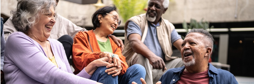 Group of people laughing together.